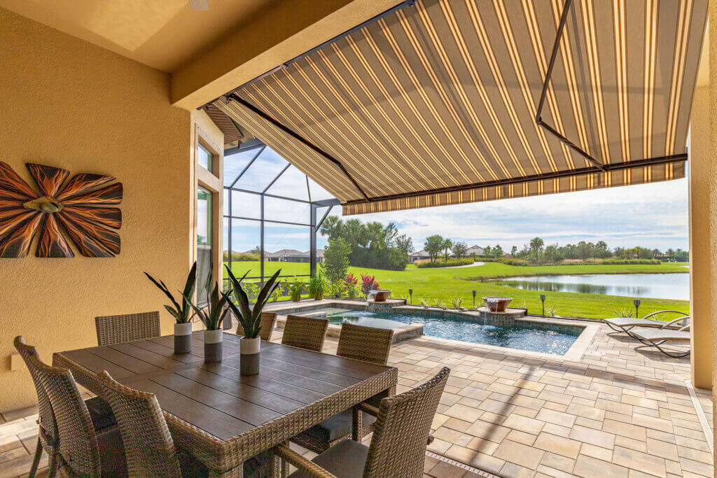retractable awning over porch on a beautiful deck with a great view